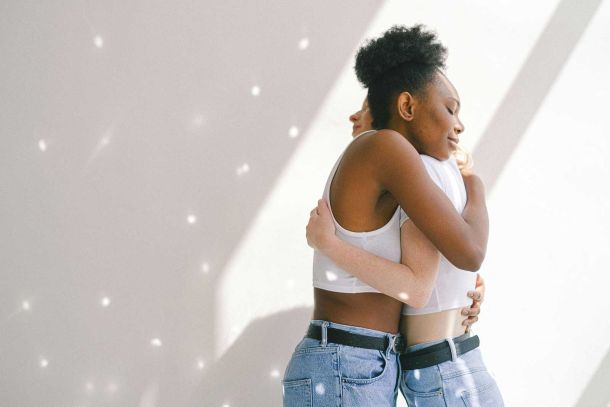 photo of women hugging