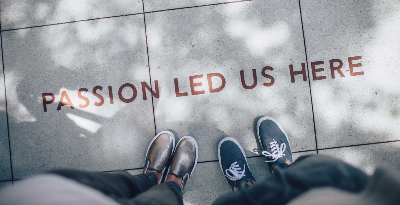 photo of a ground with different foots with a text "passion led us here"