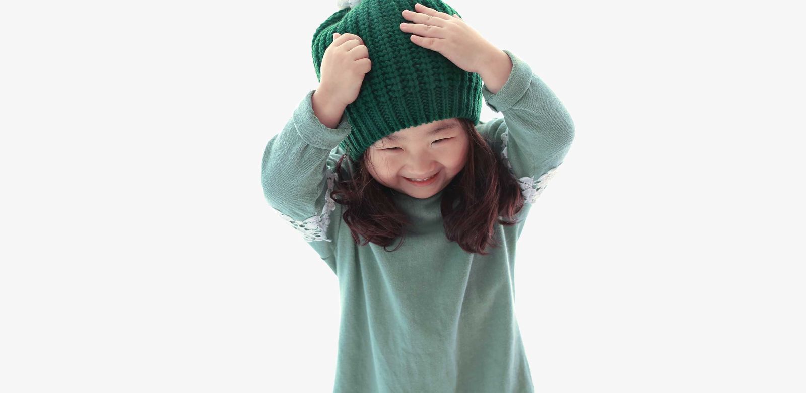 A child is drowsy and smiling after